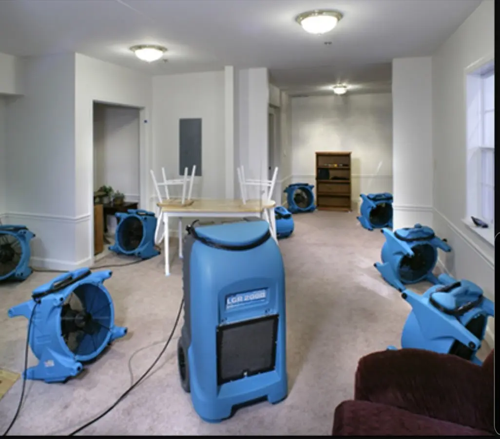 Air movers and dehumidifier setup for Water Damage Restoration in Fond du Lac